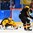 GANGNEUNG, SOUTH KOREA - FEBRUARY 16: Germany's Timo Pielmeier #51 and David Wolf #89 jump on a loose puck in front of the net during preliminary round action at the PyeongChang 2018 Olympic Winter Games. (Photo by Matt Zambonin/HHOF-IIHF Images)

